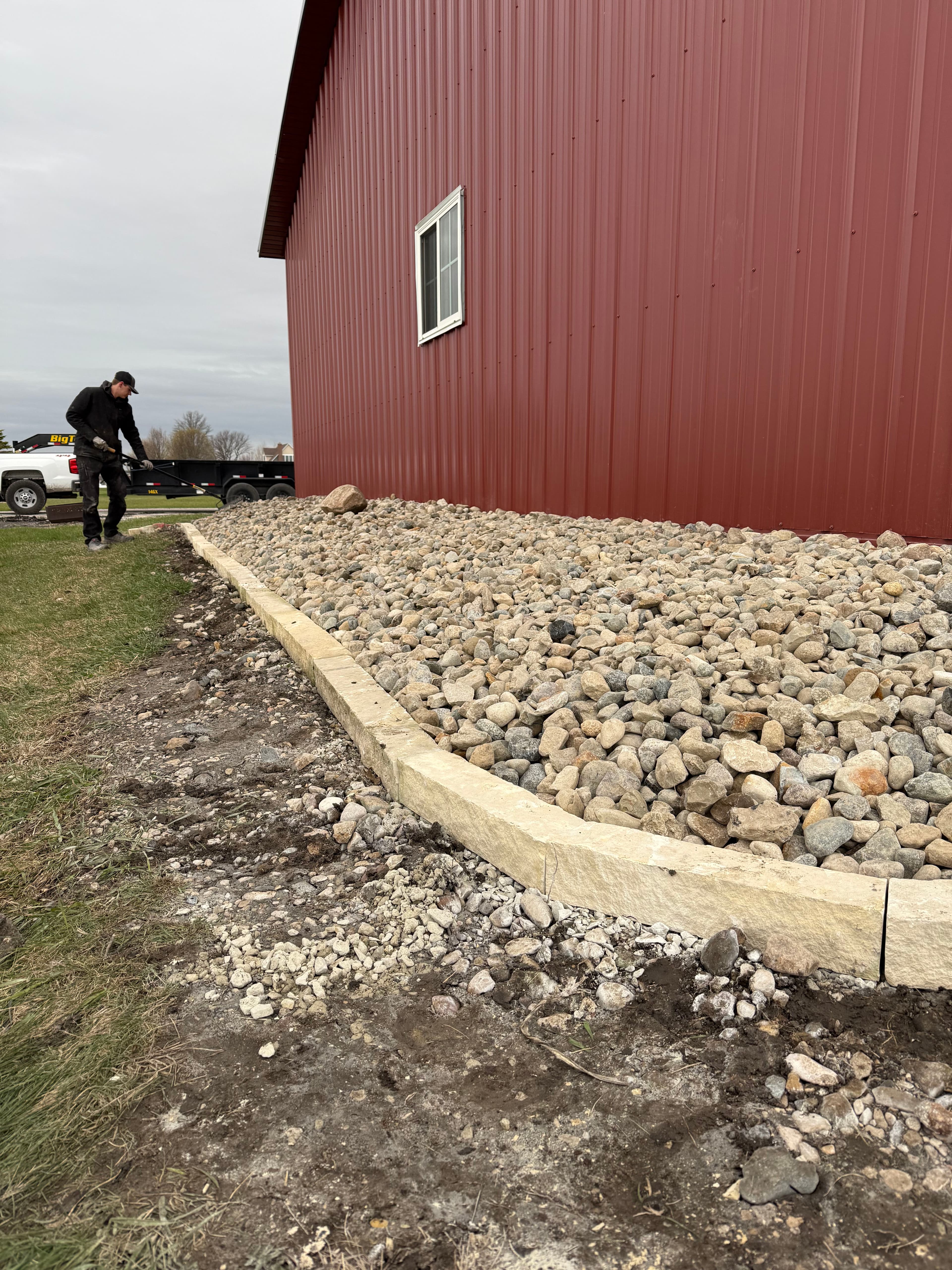 Project Natural Stone Border and River Rock Bed Installs image