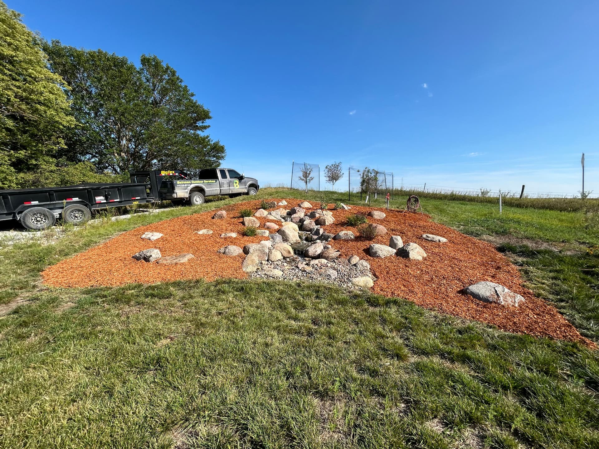 Water Feature Mulch and Rock Bed Clean-Up in Gilbert Iowa image