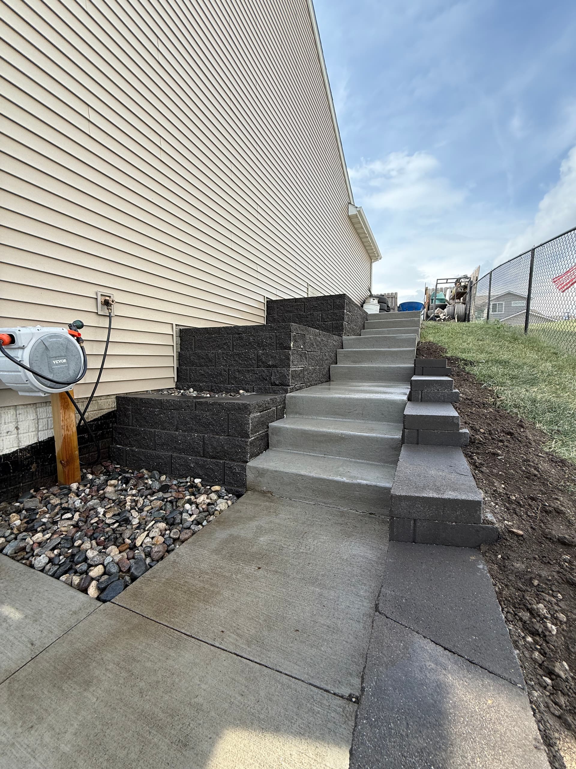 Gallery photos for Three Retaining Walls and Concrete Steps Fix a Tough Side Yard Slope: Image #1